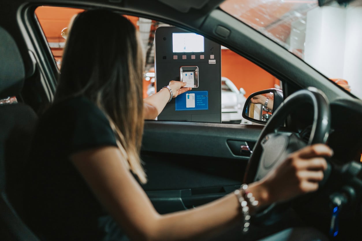 Person using parking payment machine